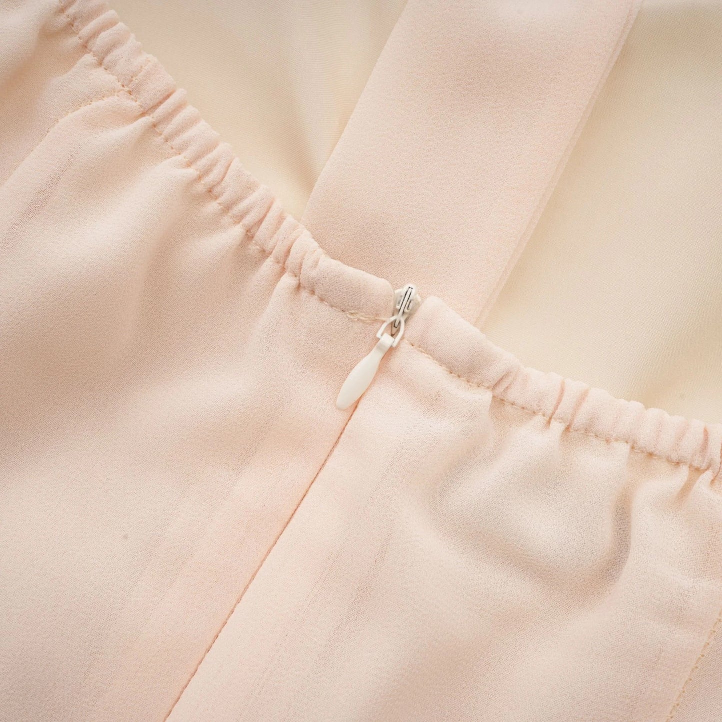 Esmerie Sleeveless Bustier Mini Dress with Back Tie Detail