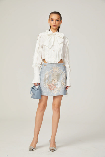 Céleste white pleated scarf-collar shirt